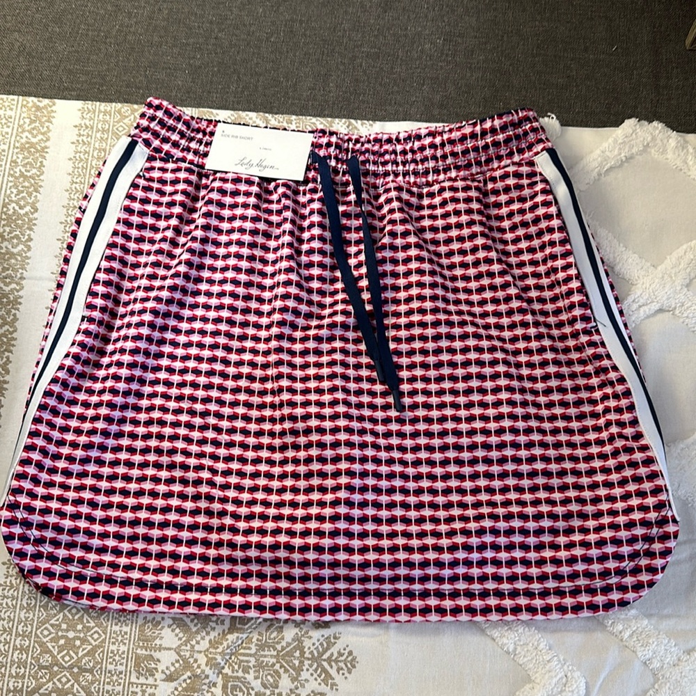 Lady Hagen off the races 16” side rib skort. Retro geo cherry red.